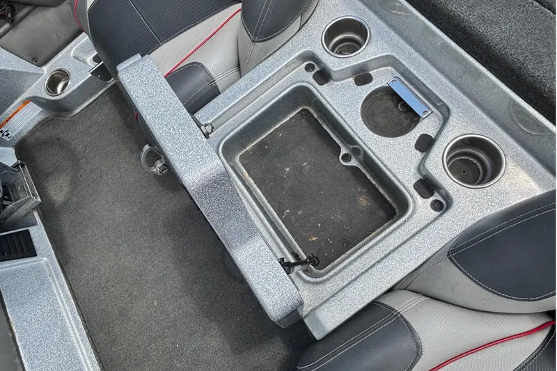Slide: The Image of Interior of a 2016 Ranger Z519 Comanche boat with cup holders and storage compartment. - 10