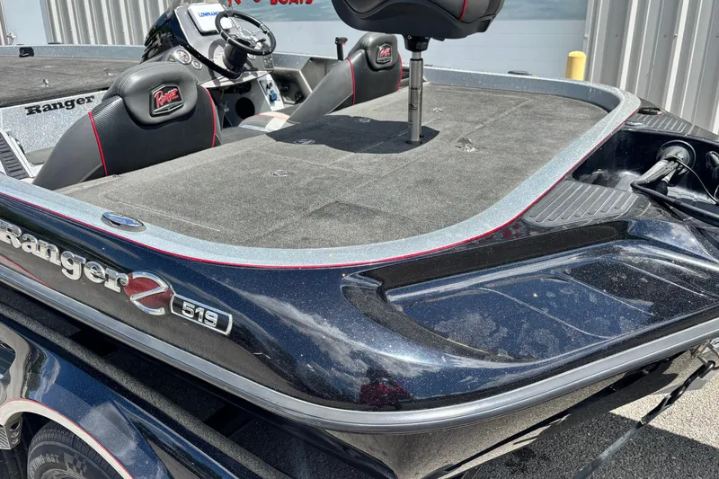 Slide: The Image of 2016 Ranger Z519 Comanche boat interior with seating and steering console. - 13