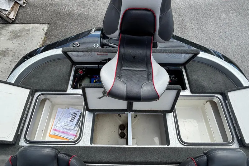 Slide: The Image of 2016 Ranger Z519 Comanche boat interior with storage compartments and seating. - 14