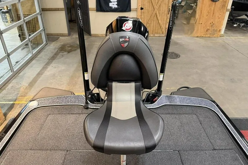 Slide: The Image of 2025 Triton 20XP Patriot boat seat in a garage setting, showcasing sleek design and craftsmanship. - 13