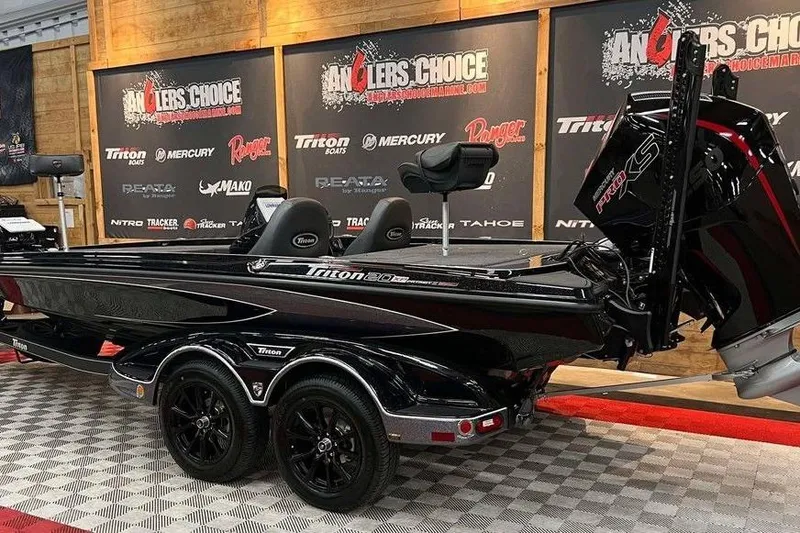 Slide: The Image of 2025 Triton 20XP Patriot boat displayed at Anglers Choice event. - 3
