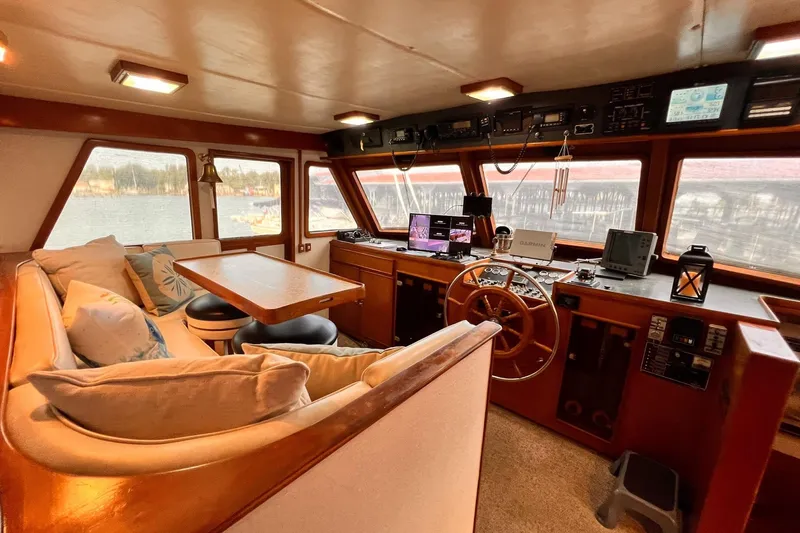 Slide: The Image of Interior of 1985 Hartman-Palmer 60 Flush Deck Motor Yacht with helm and seating area. - 19