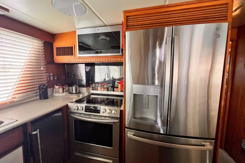 Slide: The Image of Modern kitchen in 1985 Hartman-Palmer 60 Flush Deck Motor Yacht with stainless steel appliances. - 24
