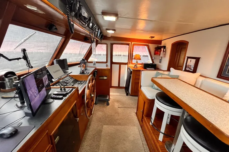 Slide: The Image of Interior of 1985 Hartman-Palmer 60 Flush Deck Motor Yacht with helm and seating area. - 28