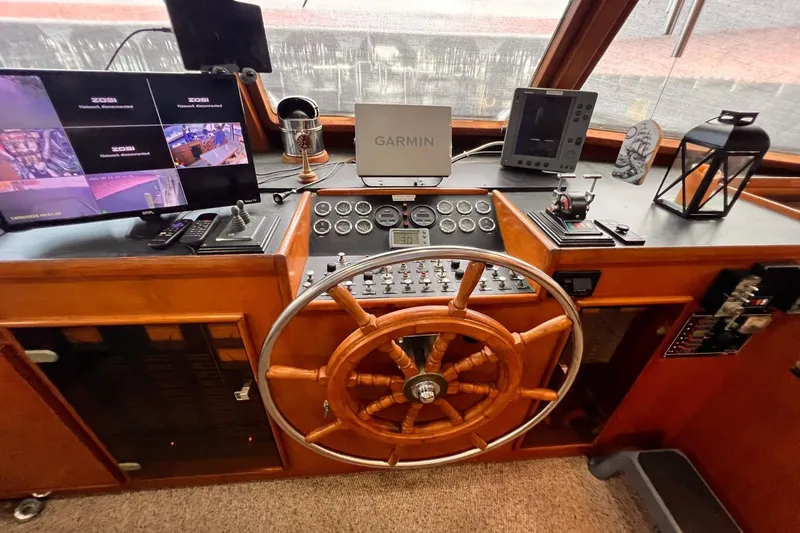 Slide: The Image of Control panel of a 1985 Hartman-Palmer 60 Flush Deck Motor Yacht with navigation equipment. - 31