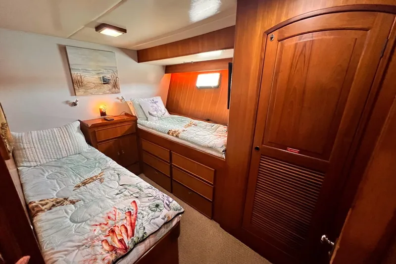 Slide: The Image of Cozy cabin interior of 1985 Hartman-Palmer 60 Flush Deck Motor Yacht with twin beds. - 52