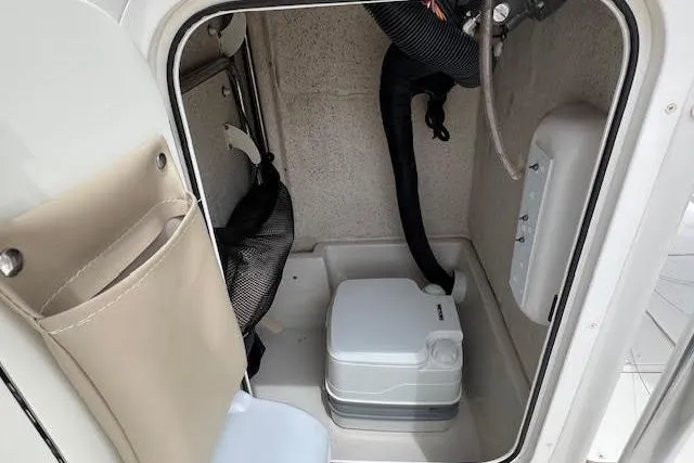Slide: The Image of Portable toilet inside 2020 Carolina Skiff 25 LS boat cabin. - 15