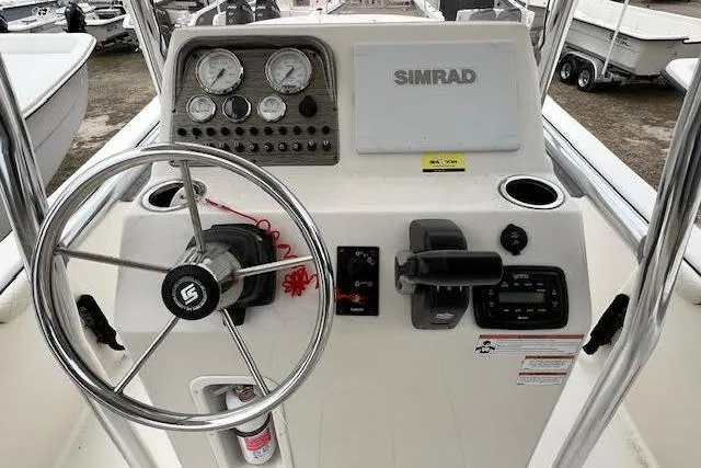 Slide: The Image of 2020 Carolina Skiff 25 LS boat console with steering wheel and Simrad display. - 4