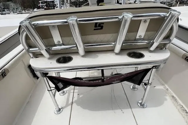 Slide: The Image of 2020 Carolina Skiff 25 LS boat seating with rod holders and cup holders. - 8