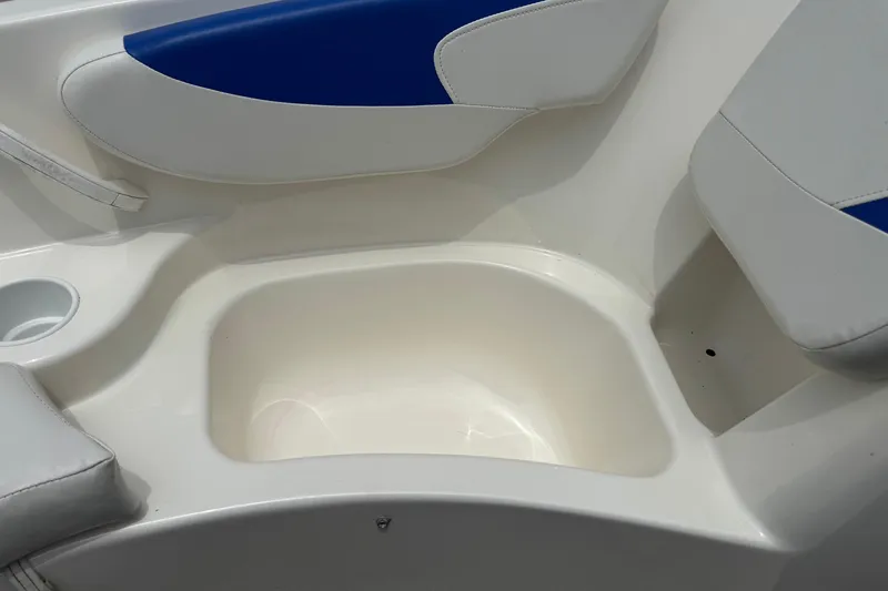 Slide: The Image of 2008 Glastron MX 175 boat interior with white and blue seating. - 14