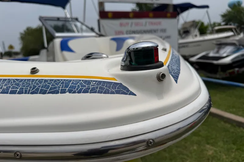 Slide: The Image of 2008 Glastron MX 175 boat with cracked blue detailing and navigation light. - 2