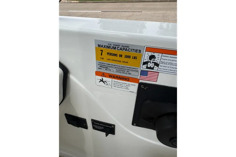 Slide: The Image of 2008 Glastron MX 175 boat capacity label, maximum 7 persons or 1000 lbs, safety warnings. - 26