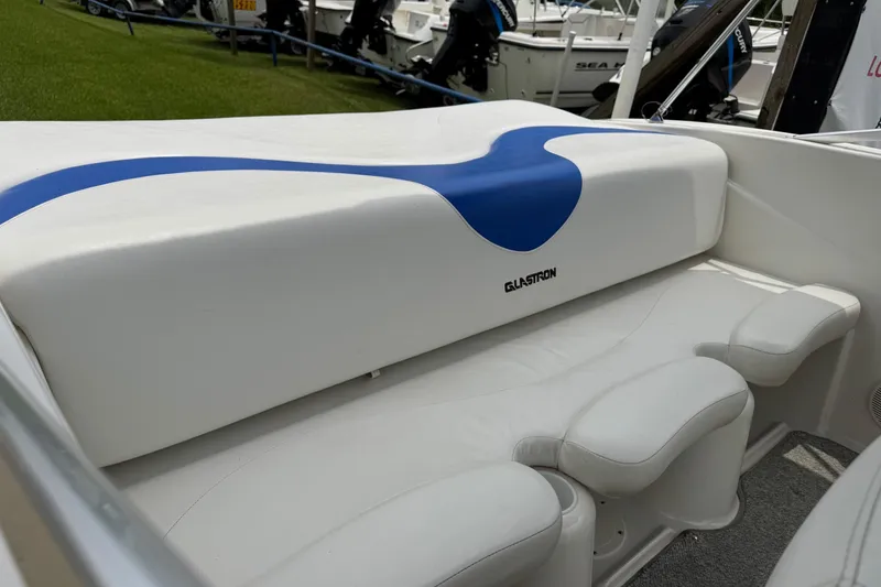 Slide: The Image of 2008 Glastron MX 175 boat interior with white and blue seating. - 6