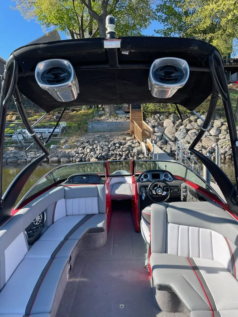 Slide: The Image of Interior view of a 2011 Supra Sunsport boat at dock. - 3