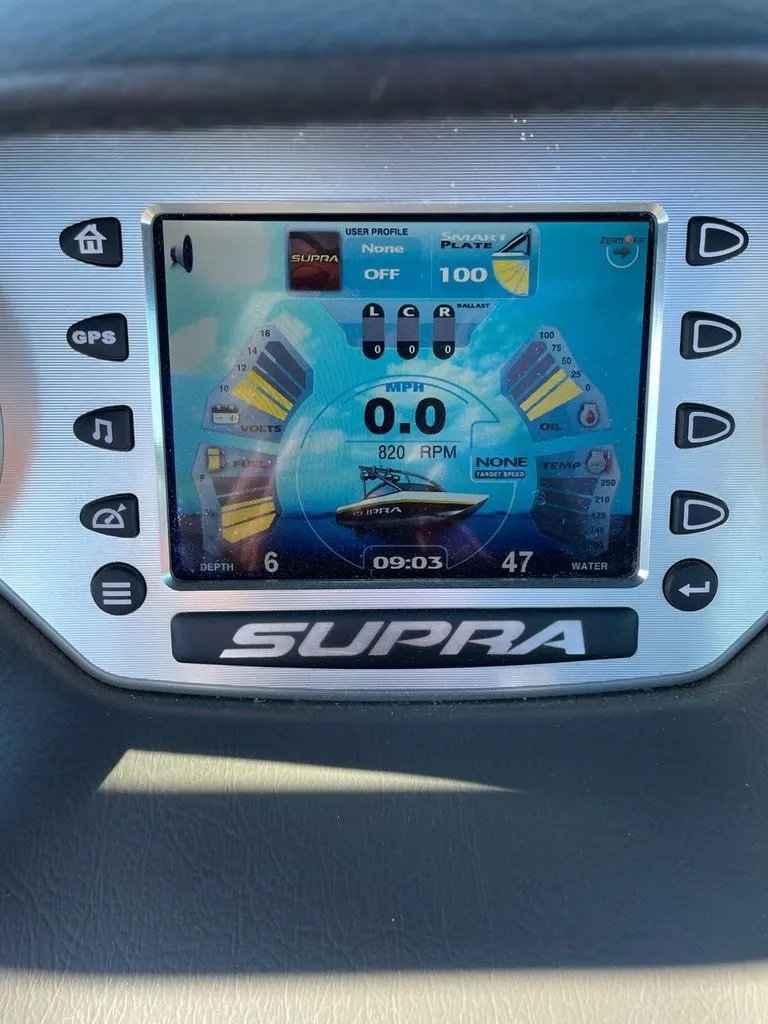 Slide: The Image of 2011 Supra Sunsport dashboard with digital display and controls. - 9