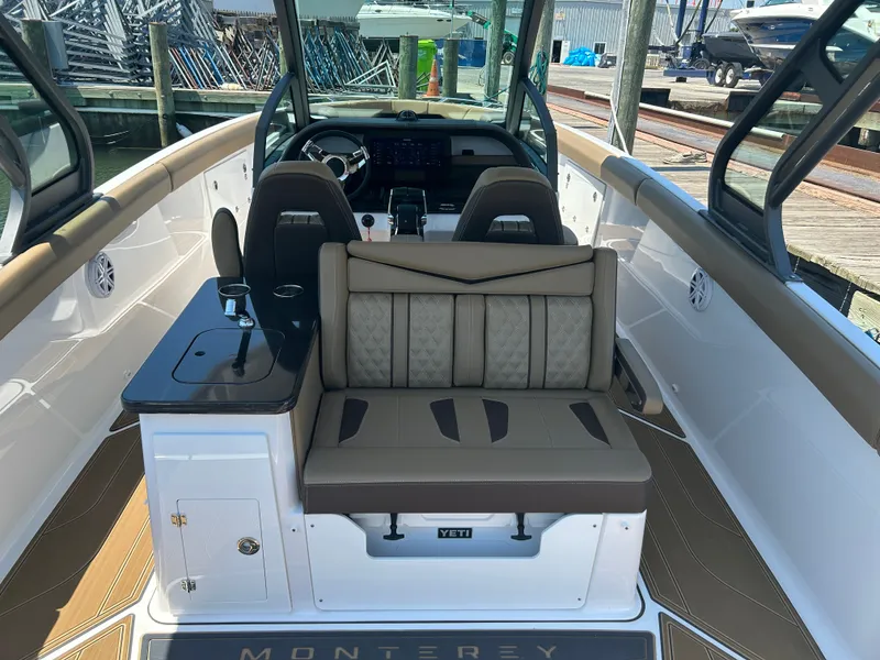 Slide: The Image of Interior of 2025 Monterey Elite 30 OB with luxurious seating. - 13