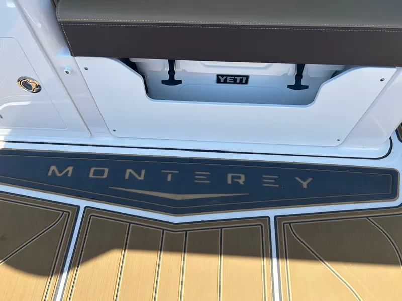 Slide: The Image of Monterey Elite 30 OB 2025 boat with Yeti cooler. - 14