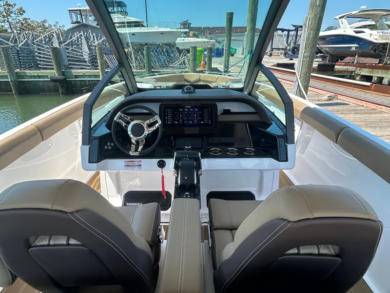 Slide: The Image of Interior view of 2025 Monterey Elite 30 OB boat at dock. - 19