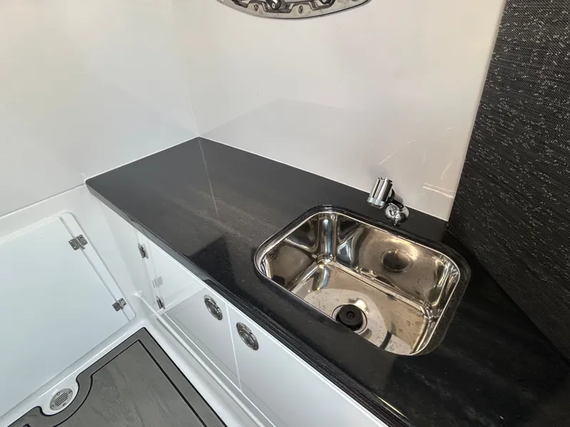Slide: The Image of Interior of 2025 Monterey Elite 30 OB featuring stainless steel sink. - 29