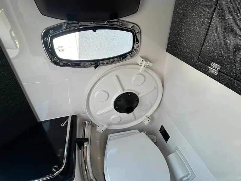 Slide: The Image of Interior of 2025 Monterey Elite 30 OB featuring toilet and window. - 32