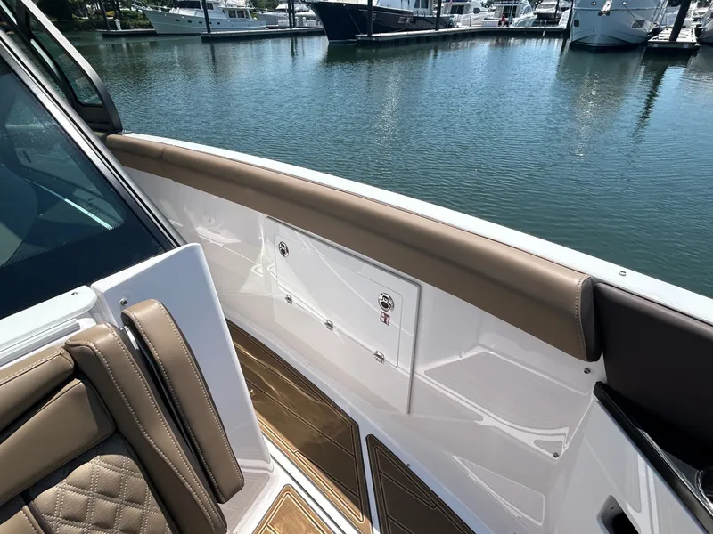 Slide: The Image of Interior view of the 2025 Monterey Elite 30 OB boat at the marina. - 33