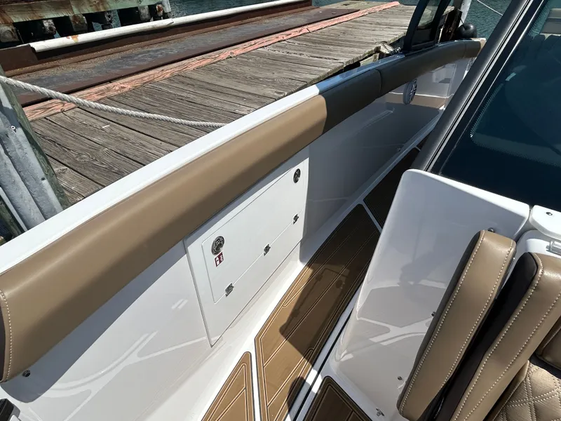 Slide: The Image of 2025 Monterey Elite 30 OB boat dock detail view. - 34