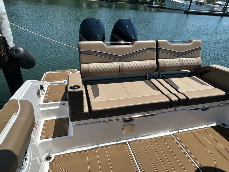 Slide: The Image of 2025 Monterey Elite 30 OB with luxurious seating area by the water. - 8