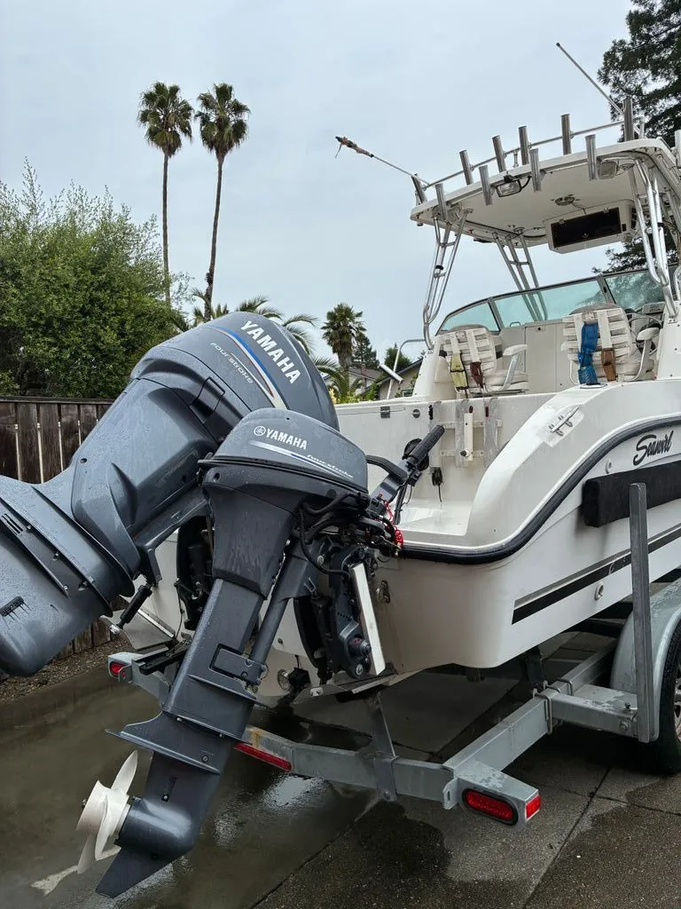 Slide: The Image of 2002 Seaswirl 2301 WA Striper boat with Yamaha engine. - 4