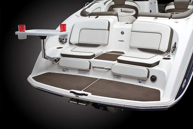 Slide: The Image of 2013 Yamaha Boats 242 Limited S interior seating, featuring white and gray cushioned seats. - 12