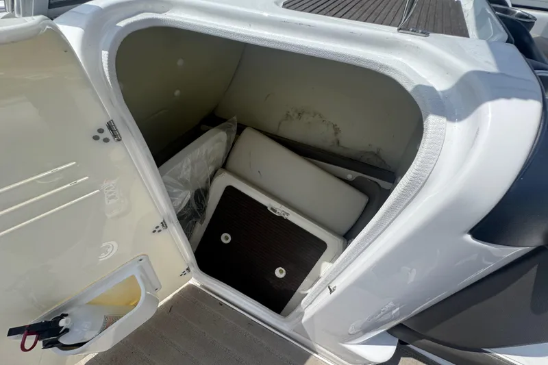 Slide: The Image of Storage compartment of a 2013 Yamaha Boats 242 Limited S, open with visible interior. - 17