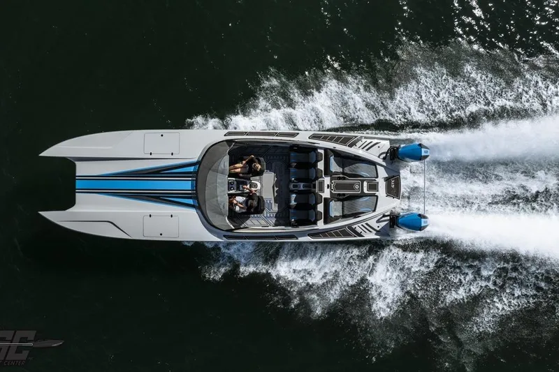 Slide: The Image of 2025 Interceptor 36 GTC speedboat cruising on water, aerial view. - 10