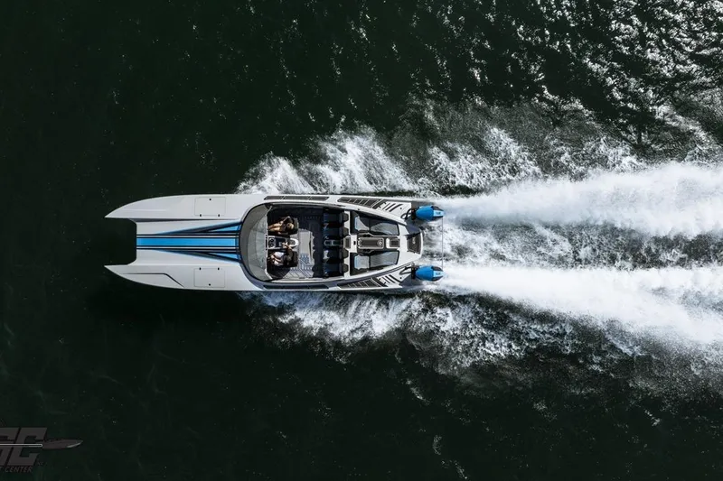 Slide: The Image of Aerial view of 2025 Interceptor 36 GTC speedboat cruising on water. - 11
