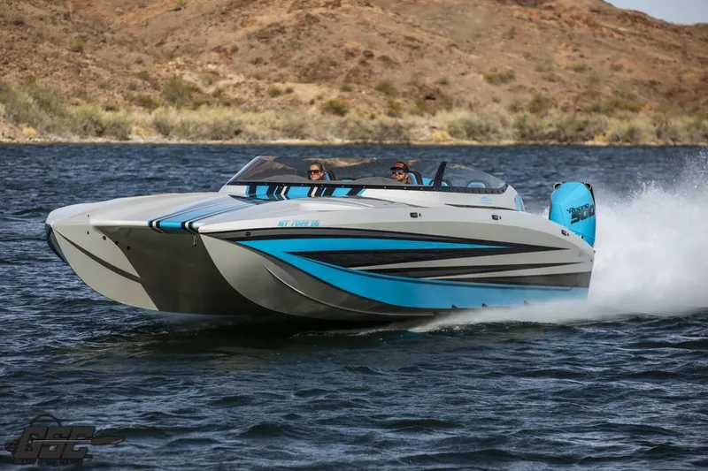 Slide: The Image of 2025 Interceptor 36 GTC speedboat cruising on a lake with scenic background. - 18