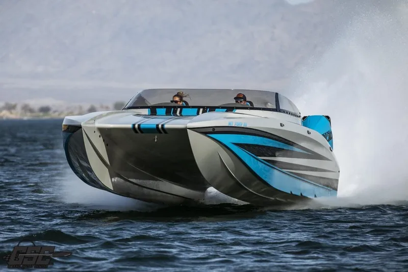 Slide: The Image of 2025 Interceptor 36 GTC speedboat gliding on water with dynamic blue and white design. - 19