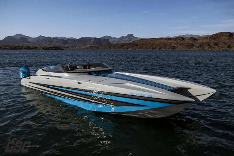 Slide: The Image of 2025 Interceptor 36 GTC speedboat cruising on a scenic lake with mountainous backdrop. - 30
