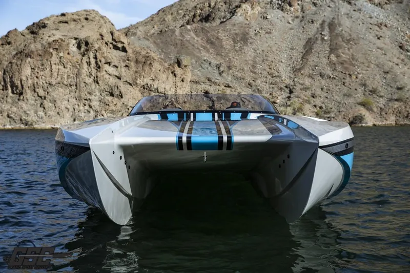 Slide: The Image of 2025 Interceptor 36 GTC boat on water, with rocky cliffs in the background. - 31