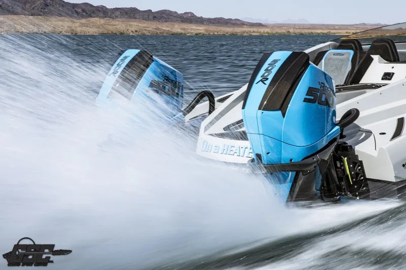 Slide: The Image of 2025 Interceptor 36 GTC speedboat with twin blue outboard motors on a lake. - 36