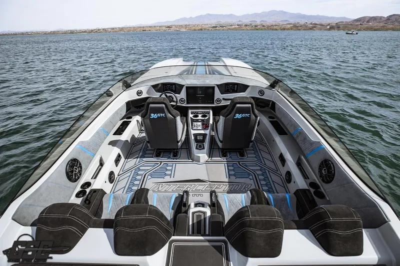 Slide: The Image of 2025 Interceptor 36 GTC boat interior with modern design and advanced controls on open water. - 46