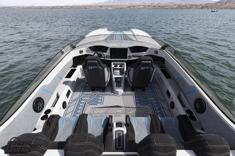 Slide: The Image of Cockpit view of 2025 Interceptor 36 GTC boat on water. - 47