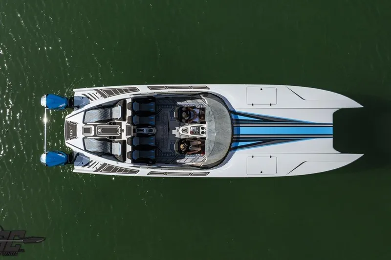 Slide: The Image of Aerial view of 2025 Interceptor 36 GTC boat on water, showcasing sleek design and dual engines. - 5