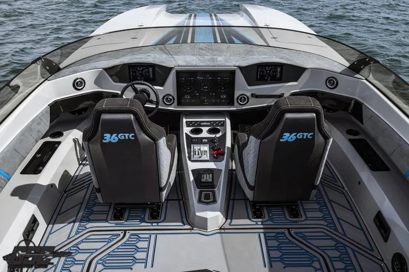 Slide: The Image of Cockpit of 2025 Interceptor 36 GTC boat with modern controls and dual seating. - 50