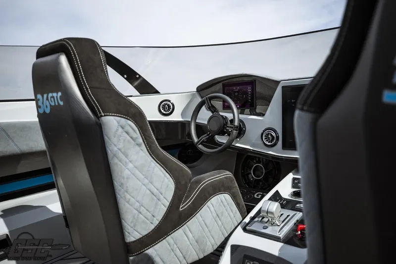 Slide: The Image of Interior of 2025 Interceptor 36 GTC boat, featuring modern steering and control panel. - 51