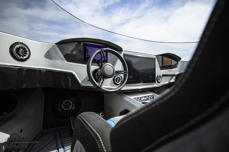 Slide: The Image of Futuristic 2025 Interceptor 36 GTC cockpit with advanced digital displays and sleek steering wheel. - 52