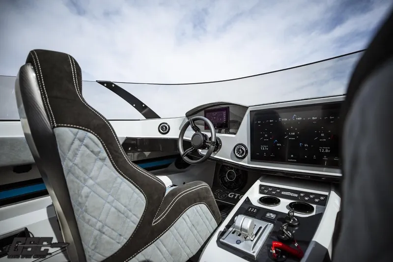 Slide: The Image of Cockpit of 2025 Interceptor 36 GTC boat with modern controls and sleek design. - 56
