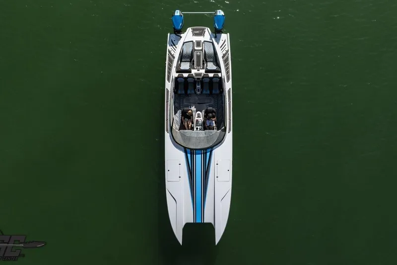Slide: The Image of Aerial view of 2025 Interceptor 36 GTC boat on calm green water. - 6