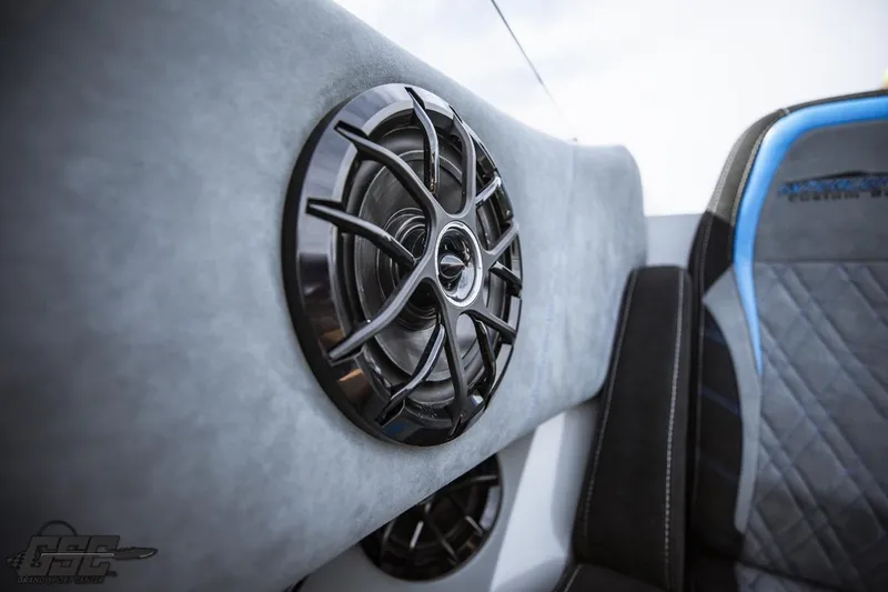 Slide: The Image of 2025 Interceptor 36 GTC interior with sleek speaker design and luxurious seating. - 61