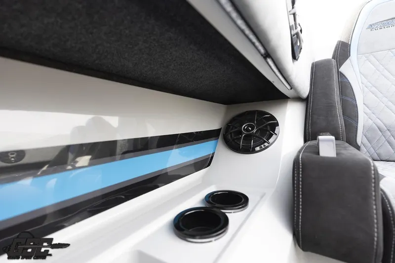 Slide: The Image of 2025 Interceptor 36 GTC interior with speaker and cup holders, featuring sleek design elements. - 62
