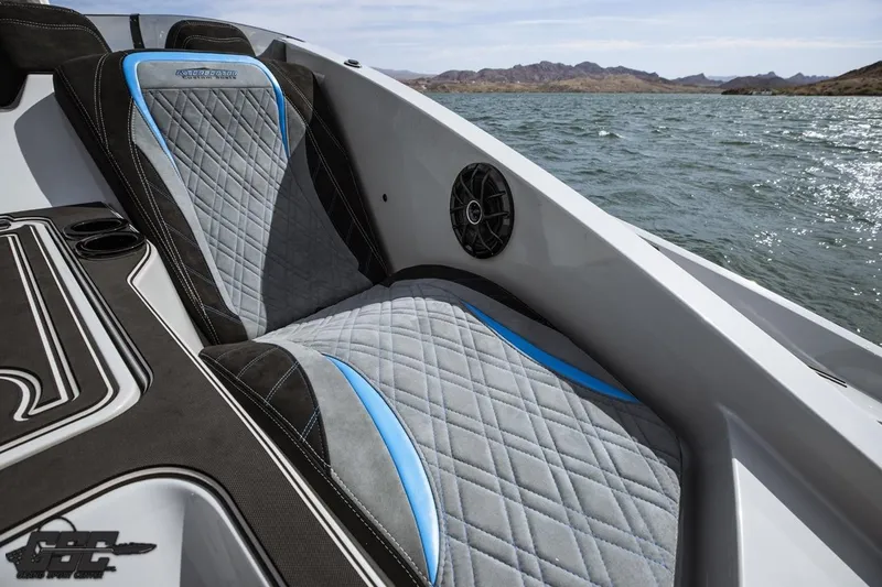Slide: The Image of Luxurious seating on 2025 Interceptor 36 GTC boat with quilted design and scenic water view. - 64