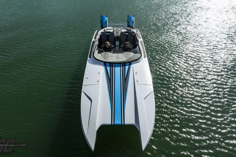 Slide: The Image of 2025 Interceptor 36 GTC boat on water, featuring sleek design and dual engines. - 7