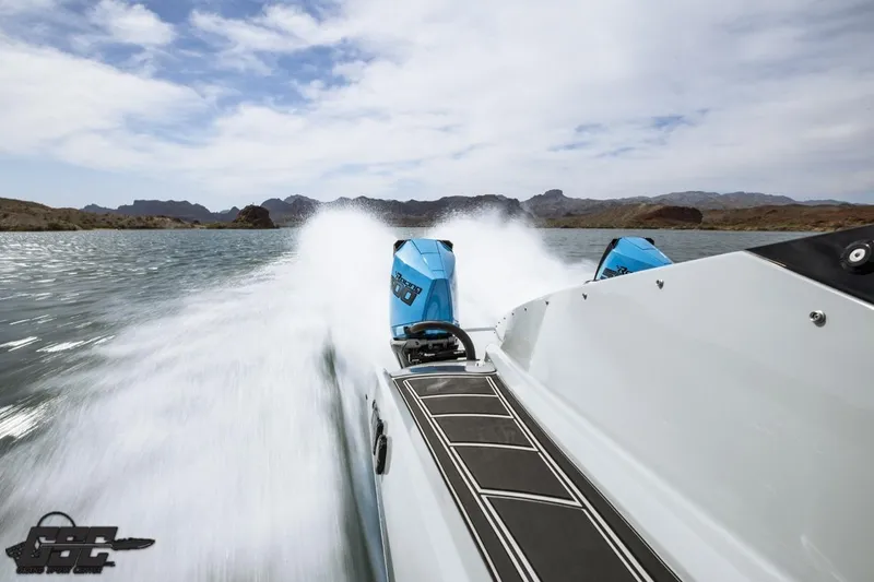 Slide: The Image of 2025 Interceptor 36 GTC speedboat cruising on a scenic lake with powerful engines. - 70